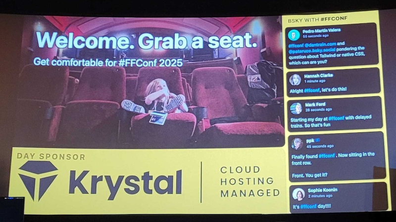 Photo of the screen at FFConf, showing a slide with a child sitting in a cinema seat and looking up, Krystal as the day sponsor, and a series of BlueSky posts on the right